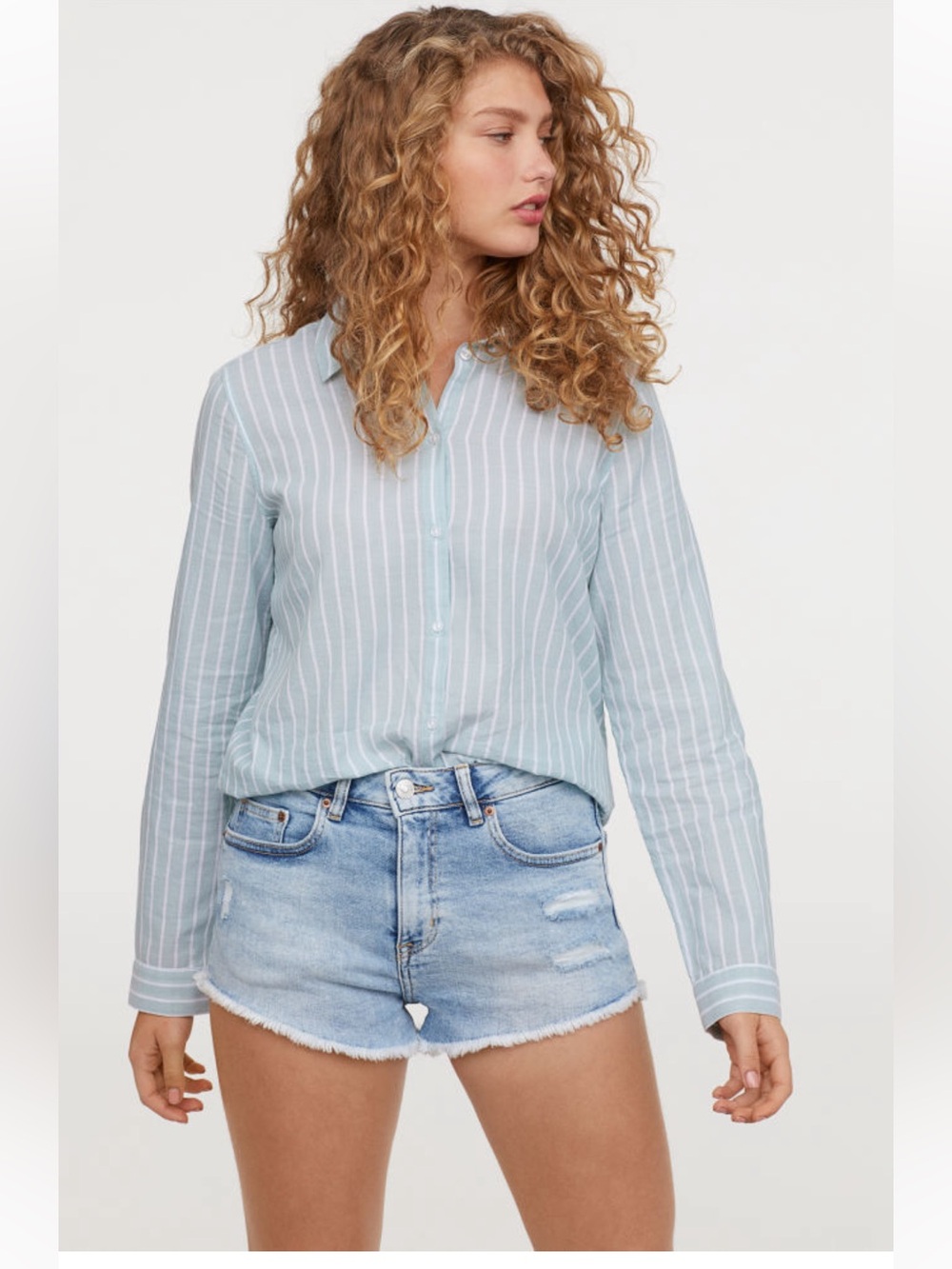 Light wash distressed denim mini shorts